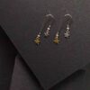 Earrings With Double Silver And Gold Metallic Stars